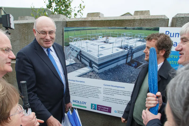 Minister Hogan viewing percolation demonstration facility